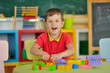 © Владимир Стороженко - A boy in the children's room playing at the table