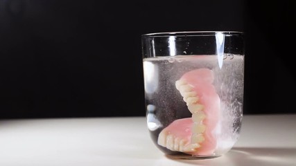 Wall Mural - Medical Dental Jaws Teeth Cleaning in Glass with Pils.