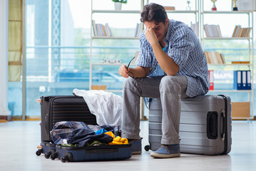 Young man preparing for vacation travel