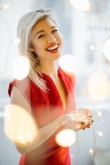 Christmas happy mood woman. Red smiling lips and red beautiful dress. shallow depth of field