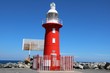 Red lighthouse North mole in Fremantle at Indian Ocean, Perth Western Australia 