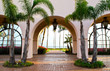 view of the Pacific ocean through a courtyard archway