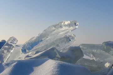 Wall Mural - clumps of ice lie on the lake in sunny weather.