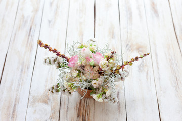 Bouquet of flowers on a old wooden background