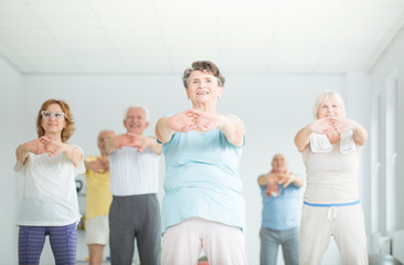 Athletic senior people stretching