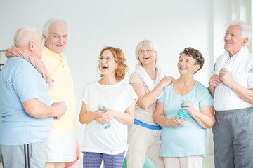 Sticker - Smiling senior friends in sportswears