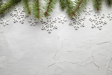 Sticker - Spruce tree and snowflakes on white background