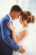 © ruslan1117 - bride and groom on background clear windows