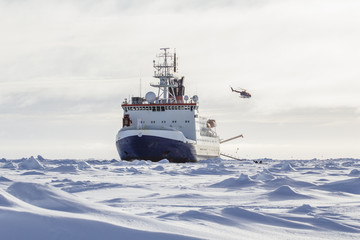 Wall Mural - Research icebreaker and helicopter