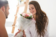 © LIGHTFIELD STUDIOS - handsome young man presenting beautiful bouquet to girlfriend in morning