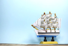 Old Wooden Ship With Sails And Masts Toy On A Stand. Vintage And