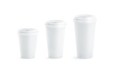 Fototapete - Blank white disposable paper cup mock ups with closed lids isolated, 3d rendering. Empty coffee drinking mug mockup front view. Clear tea take away plastic package, cofe shop branding template.