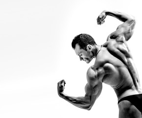 Wall Mural - athletic guy - bodybuilder,  pose on white background