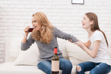 Wall Mural - An adult woman drinks alcohol.