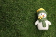 © Sergei Timofeev - Little cute toy christmas snowman on green background