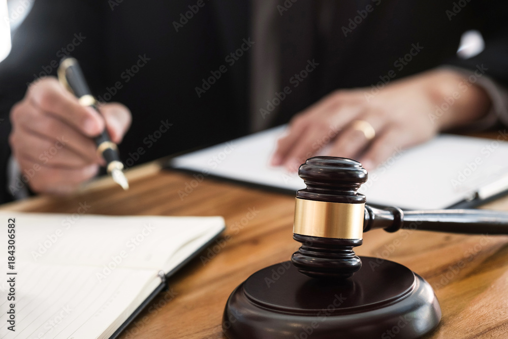 justice lawyer / judge gavel working with legal documents in a court room - obrazy, fototapety, plakaty 