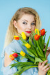 © Voyagerix - Pretty woman with red yellow tulips bunch