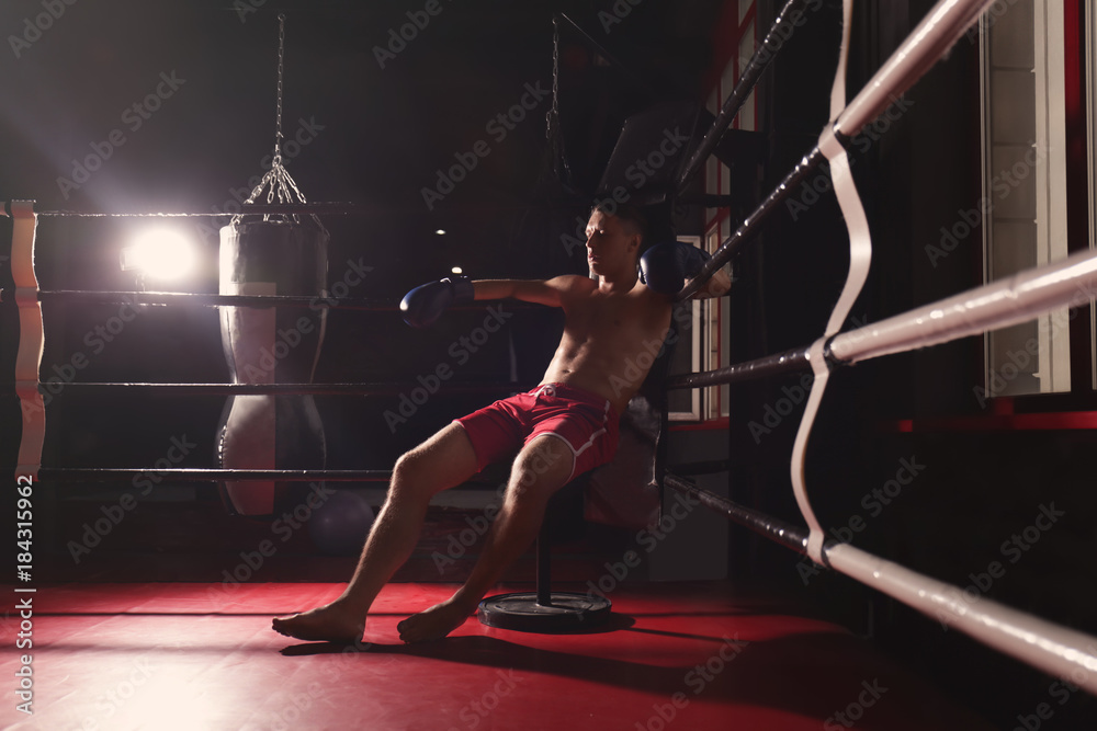 Professional boxer having break during training