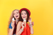 © Africa Studio - Attractive hipster girls posing with ice cream on color background