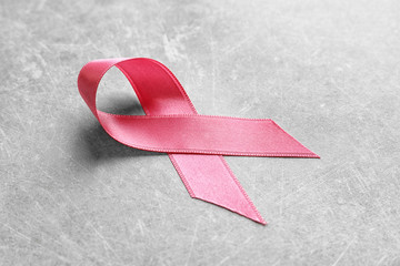 Poster - Pink ribbon on grey background. Breast cancer awareness concept