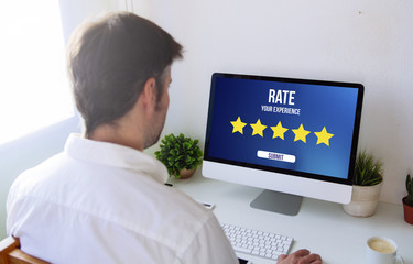 Poster - man rating on computer