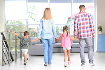 Poster - Happy family in room at new house