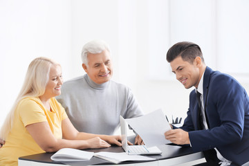 Sticker - Senior couple meeting with consultant in office