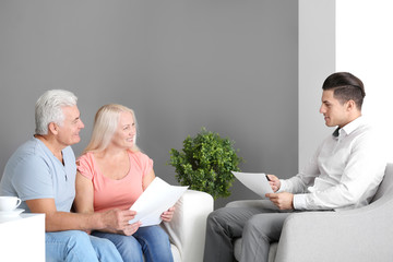 Wall Mural - Senior couple meeting with consultant in office