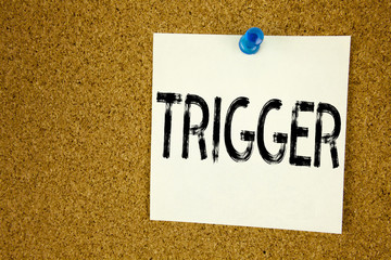 Leinwandbilder - Conceptual hand writing text caption inspiration showing Trigger. Business concept for  Stir Spark Loose or Unleash Idea written on sticky note, reminder cork background with copy space