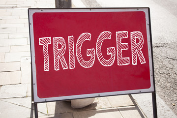 Leinwandbilder - Conceptual hand writing text caption inspiration showing Trigger. Business concept for Stir Spark Loose or Unleash Idea written on announcement road sign with background and copy space