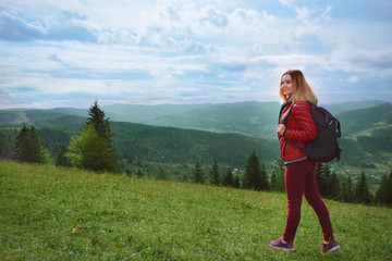 Sticker - Beautiful female tourist in mountains