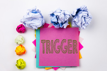 Leinwandbilder - Writing text showing Trigger written on sticky note in office with screw paper balls. Business concept for Stir Spark Loose or Unleash Idea on the white isolated background.
