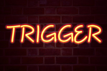 Leinwandbilder - Trigger neon sign on brick wall background. Fluorescent Neon tube Sign on brickwork Business concept for Stir Spark Loose or Unleash Idea 3D rendered