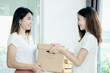 © jumlongch - Young asian girl is freelancer with her private business at home office, working with laptop, coffee, online marketing, Customer order and packaging or packing.