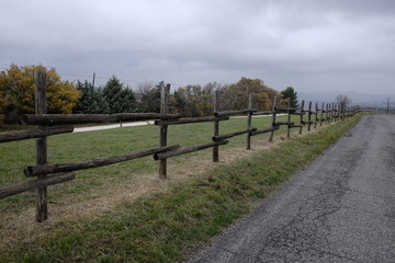 Wall Mural - wooden fence along the road