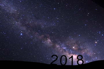 Wall Mural - night landscape with milky way and silhouette of high mountain for happy new year 2018, starry sky w
