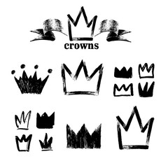 Big set of silhouettes of crowns. Black grunge icons. Painted by hand with a rough brush. Vector illustration. Isolated on white background