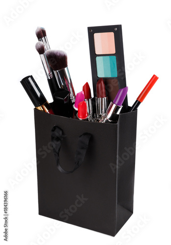 Valokuva Different makeup objects in the shopping bag