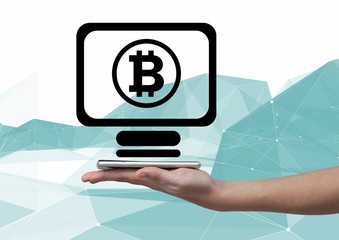 Fototapete - Bitcoin computer icon and hand holding phone