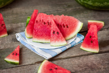 Wall Mural - Slices of watermelon on plate and table