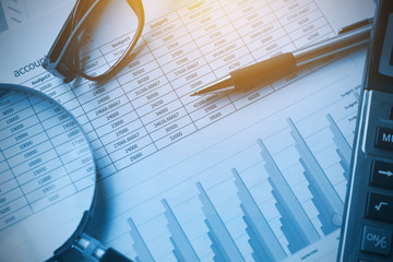 Fototapete - business documents accounting with calculator, pen, glasses and magnifying glass. concept for financial