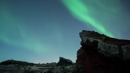 Wall Mural - people in distance watching aurora borealis over moonlit volcanic terrain iceland nr and maybe