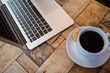 © WavebreakMediaMicro - Close up of laptop and coffee cup on table