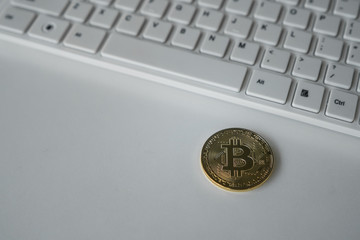 Sticker - Gold bitcoin on the table with keyboard. Symbol of crypto currency. Virtual currency. BTC.