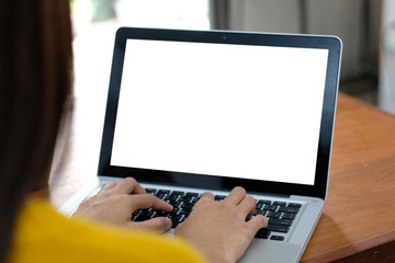 Woman hands typing laptop computer with blank screen for mock up template background, business technology and lifestyle background concept