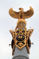 Astana. Kazakhstan. Golden figure of a bird Samruk at the top of the majestic monument 
