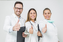 Friendly Group Of Doctors With Thumbs Up