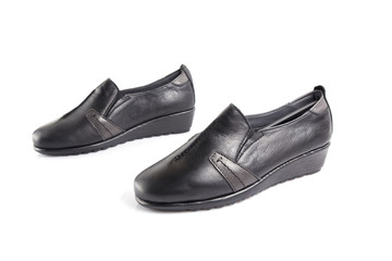 Female black leather shoe on white background, isolated product, comfortable footwear.