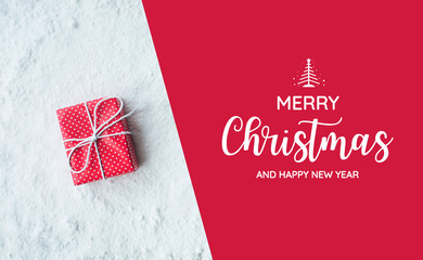Wall Mural - merry christmas and happy new year text with gift box,present on snow background