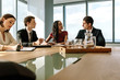 © Jacob Lund - Group of corporate professionals having meeting